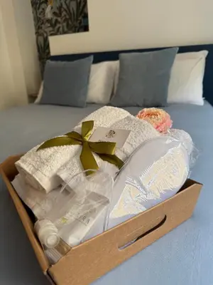 a wooden box filled with items on a bed at Hestya Domus in Rome