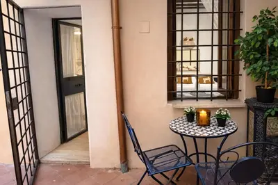 a small table and chairs on a patio at Piazza Navona Historic Escape in Rome