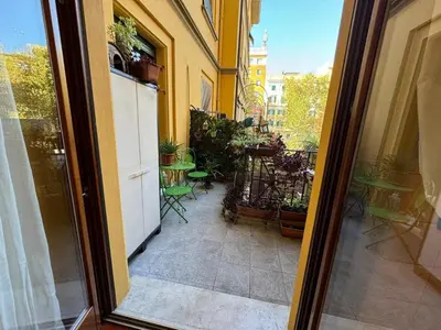 an open door to a balcony with a patio at Doria Boutique Apartment in Rome