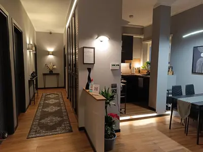 a hallway with a dining room and a kitchen at Trastevere Noir in Rome