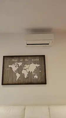 a map of the world hanging on a wall at A Casa di Luca in Rome