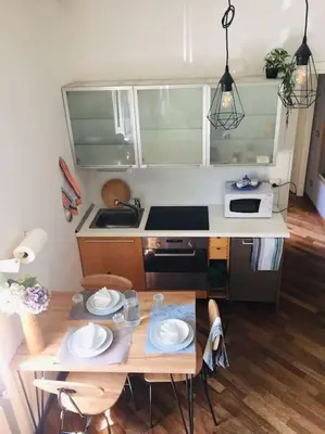 a small kitchen with a table and a stove at La Casetta di Roma in Rome