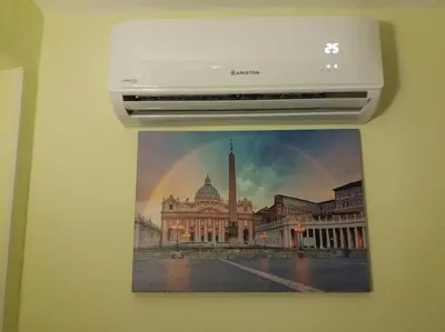a picture of a building with a rainbow on the wall at Holiday Home Naiadis in Rome