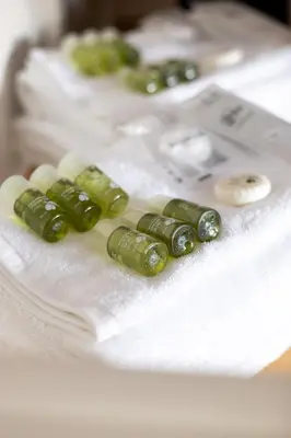 a bunch of green pills sitting on a napkin at Maison Riboty in Rome