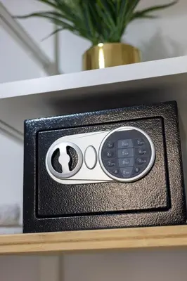 a remote control on a shelf with a plant at Maison Riboty in Rome