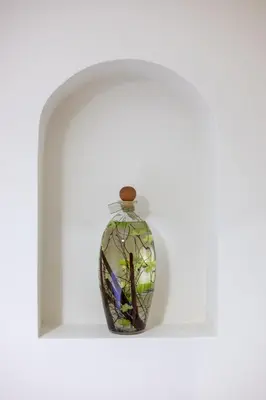 a glass vase sitting on a shelf at Maison Riboty in Rome