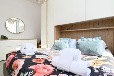 a bedroom with a bed with towels on it at Casa Vacanze Marrucini in Rome