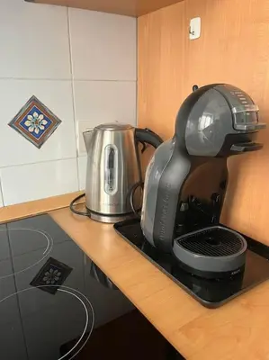 a mixer sitting on top of a kitchen counter at Family Apartment by Metro A Vatican Museums in Rome