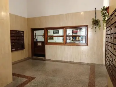 an empty room with a window and a door and a room with at A casa di Gi in Rome