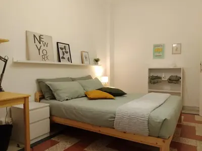 a bedroom with a bed in a room at A casa di Gi in Rome
