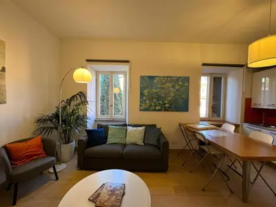 a living room with a couch and a table at Green Oasis in Villa Riccio in Rome