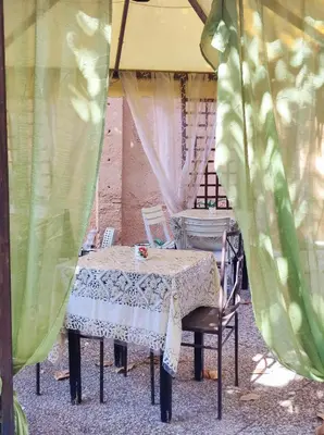 a table and chairs sitting under a tent at Tucci's Roma Guest House in Rome