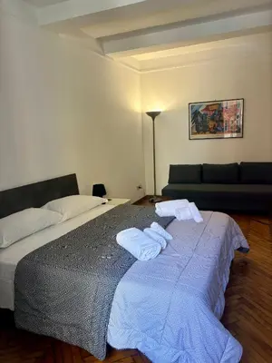 a bedroom with a bed with towels on it at Dimora Sistina Roma in Rome