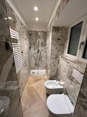a bathroom with a shower and a toilet and a sink at Luxury apartments, Piazza di Spagna in Rome