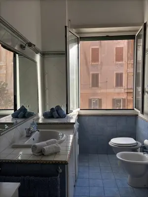 a bathroom with a tub and a sink and a toilet at Vodice Apartment- Between Vatican and Foro Italico in Rome