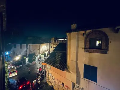 a view of a city street at night at Scala 31 Trastevere in Rome