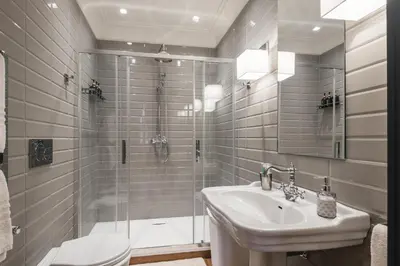 a bathroom with a shower and a sink and a toilet at Mega Royal Suite in Rome