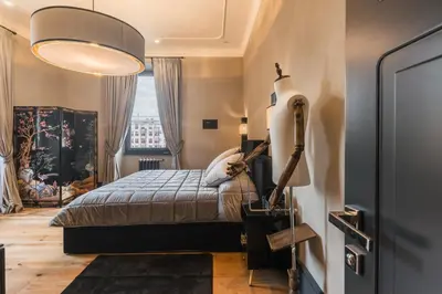 a bedroom with a bed and a large window at Mega Royal Suite in Rome