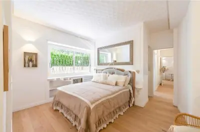 a white bedroom with a bed and a window at Vatican Home 168 in Rome
