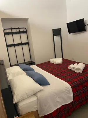 a bedroom with two beds with pillows on them at Il diamante del Colosseo in Rome