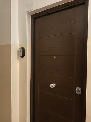 a brown door with a drawer in a room at Il diamante del Colosseo in Rome