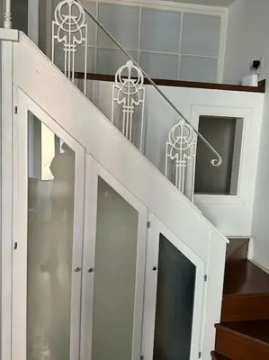 a set of stairs with a white stair railing at Tata Home Monti in Rome