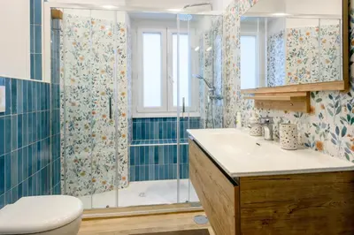 a bathroom with a toilet sink and a shower at 