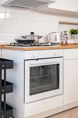 a kitchen with a white stove top oven at MichaelHouse in Rome