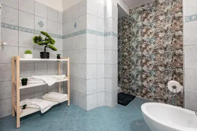 a bathroom with a sink and a toilet and a tub at MichaelHouse in Rome