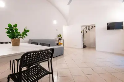 a living room with a table and a couch at MichaelHouse in Rome