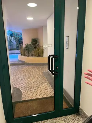 a green door with a glass door sidx sidx sidx at Sweet Home Cavalese, Cortina d'Ampezzo, Università Cattolica, Gemelli in Rome
