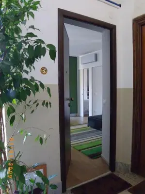 a door leading into a room with a hallway at Casa Sardi in Rome