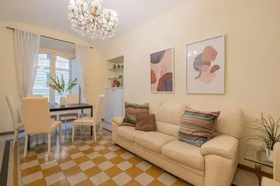 a living room with a couch and a table at Apartment In Via Merulana Central Rome by Halldis in Rome