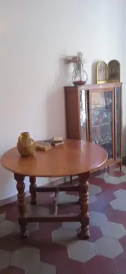 a wooden table with a bowl on top of it at InsideRome Appartamento Vaticano e Centro Storico in Rome