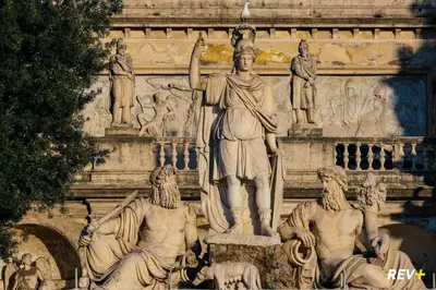 a statue of a man standing in front of a building at Art Apartment Rome City Center in Rome