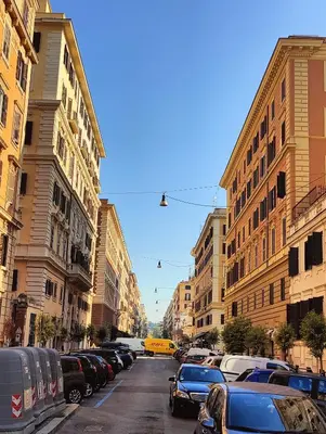 a city street with parked cars and buildings at Appartamento Gracchi 15 in Rome