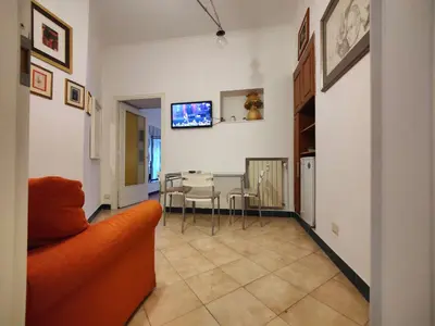 a living room with a couch and a table at Appartamento Gracchi 15 in Rome