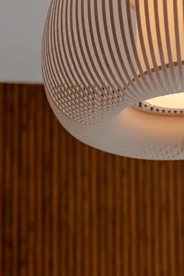 a white light fixture hanging from a wooden wall at Sangió - Lovely Home in Rome in Rome