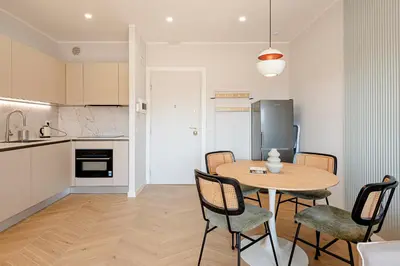 a kitchen and dining room with a table and chairs at Sangió - Lovely Home in Rome in Rome