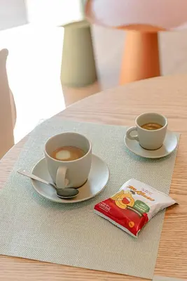 two cups of coffee sitting on a table at Sangió - Lovely Home in Rome in Rome