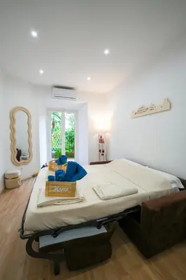 a bedroom with a bed with a box on it at Camelia's Garden in Rome