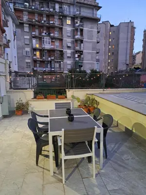 a table and chairs on top of a building at Appartamento Prenestina 74 in Rome