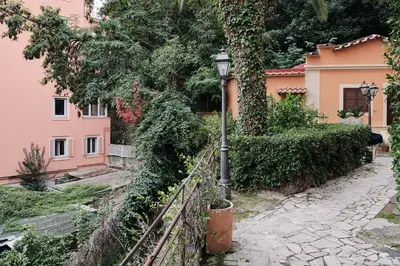 a street light in front of a pink house at Trastevere luxury apartment in Rome