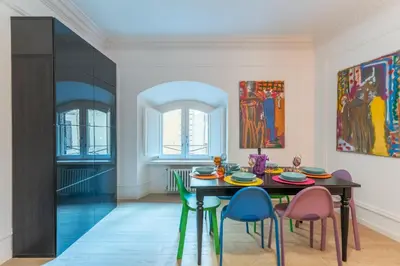 a dining room with a table and chairs at Casa degli Dei in Rome