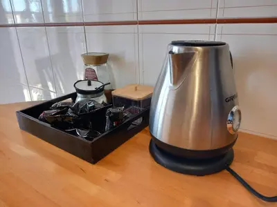 a blender sitting on top of a wooden table at St Peter's view penthouse 300 mt metro A stop in Rome