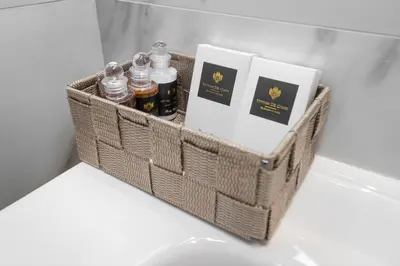 a basket with bottles of essential oils in a refrigerator at La Genziana in Rome