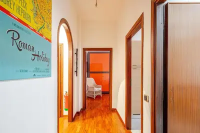 a hallway leading to a room with a bed at Vespa s house 10 minuti Musei Vaticani in Rome
