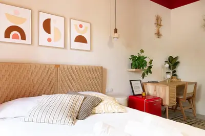a bedroom with a bed with two dolls on it at DomusFebo SanGiovanniSuites in Rome