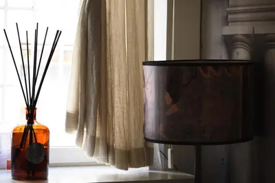 a lamp and a vase sitting next to a window at BDB Rooms Trastevere in Rome