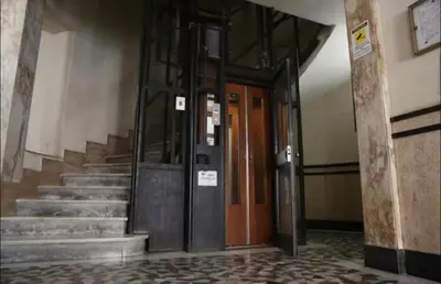 an entrance to a building with doors and stairs at Cozy House Roma - San Giovanni in Rome